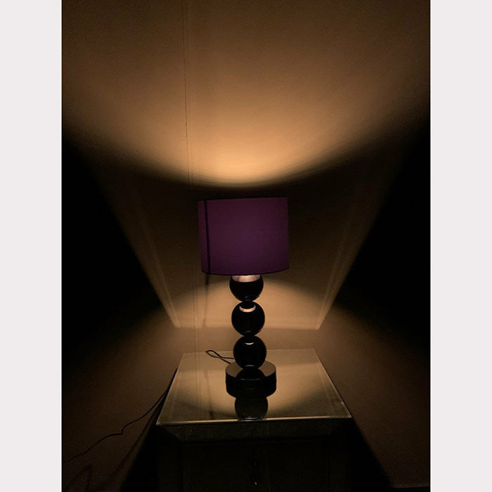 Kleine antraciet bollamp met verlichting aan